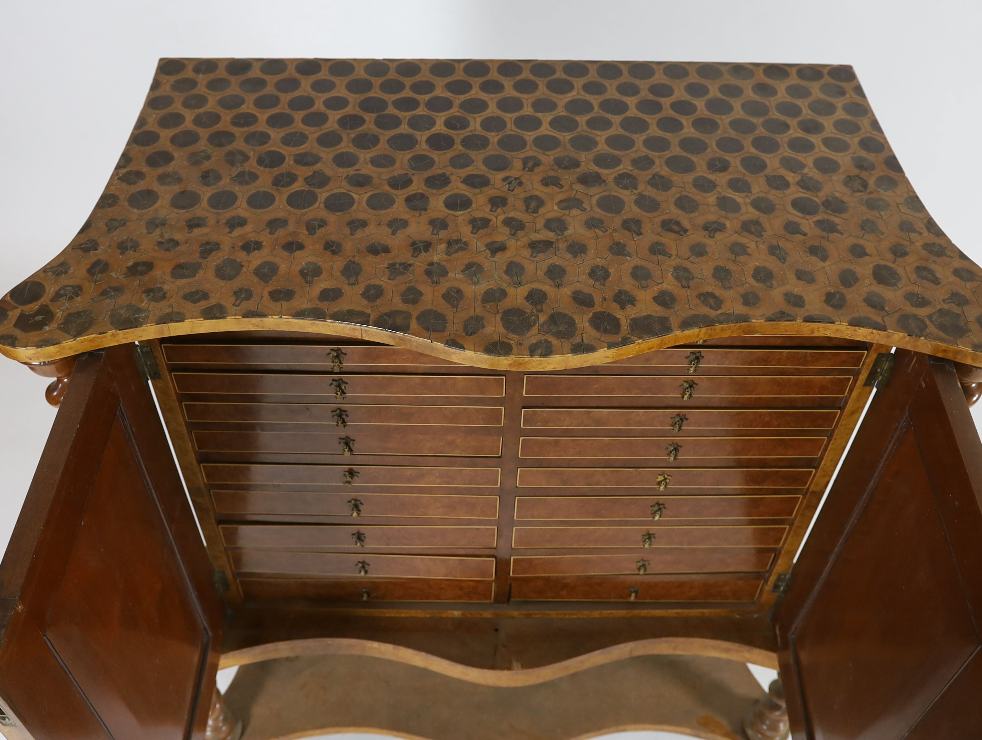 A 19th century Irish yew wood, oyster veneered and burr wood serpentine collector's cabinet, W.118cm D.57cm H.128cm